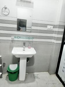 a bathroom with a sink and a mirror at The Himalayan Homes in Tokna +21 photos