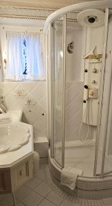 a bathroom with a shower and a sink at Haus Schaper in Westerland +39 photos