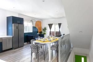 a kitchen and dining room with a table and chairs at Central LA Escape Near Universal & Beaches in Los Angeles
