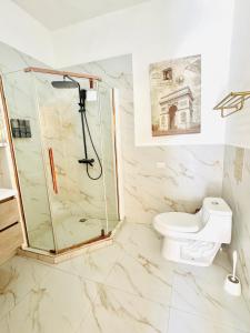 a bathroom with a shower and a toilet at DUBAI by luxury Atitlan in San Pedro La Laguna +33 photos
