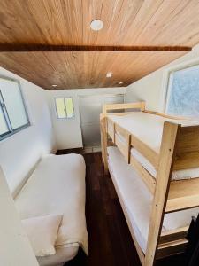a small room with two bunk beds in it at Kamakura S house in Yokohama