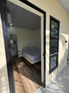 a bedroom with a bed in a room with a doorway at Hotel ANY in Los Córdobas