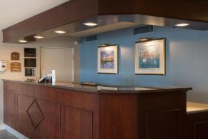 a bar in a hospital with two pictures on the wall at Ramada by Wyndham Boston in Boston