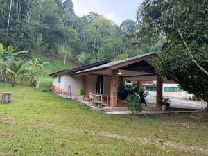 a small house in the middle of a field at MICKaL in Bang Hin Chang (1)