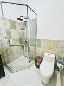 a bathroom with a shower and a toilet at LA VILLA by luxury Attilan in San Pedro La Laguna +48 photos