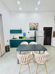 a table and two chairs in a kitchen at LA VILLA by luxury Attilan in San Pedro La Laguna