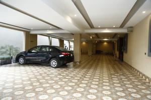 a car parked in a room with a garage at Ilva Hotel in Lahore