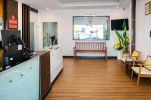 a salon with a waiting room with a bench at EL Zahraa Moda Hotel Alor Setar in Alor Setar