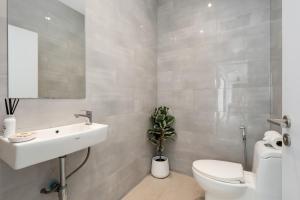 a bathroom with a white sink and a toilet at Savaya Samui Villa in Ban Ko Khwan +51 photos