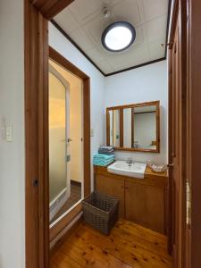 a bathroom with a sink and a mirror at スピークイージー in Higashiizu +127 photos