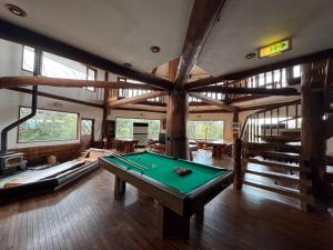 a large room with a pool table in it at スピークイージー in Higashiizu