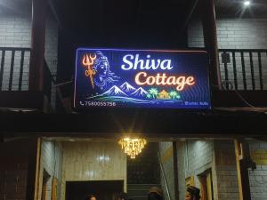 a sign for a shiva conference on a building at Shiva cottage in Kullu Manali