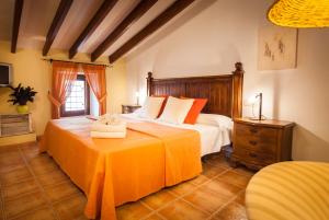 Cama o camas de una habitación en Petit Hotel Alaro