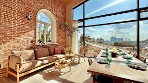a living room with a couch and a table at FORESTE Haus 포레스테하우스 in Seoul