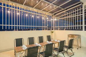 a conference room with a table and chairs in it at House Nguyễn in Da Lat