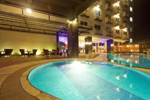 a swimming pool in front of a building at night at Nagoya Mansion B1222 in Nagoya +3 photos