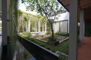 an external view of a garden with a river at Green Minimalist in Jakarta