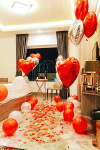 a room with red and white hearts and balloons at Queen Hotel Van Phu Urban in Hà Ðông