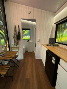 a kitchen with a sink and a toilet in a room at Under the Velvet Sky by Tiny Away in Dagun