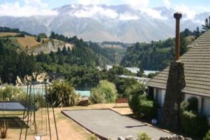 a house with a view of a mountain at Mt Hutt Lodge in Windwhistle