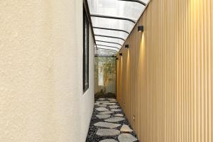 a hallway of a building with a walkway at 부천 브라운도트 호텔 부천역점 in Sosa