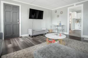 a living room with a couch and a table at Cozy Croghan Apartment in Croghan +8 photos