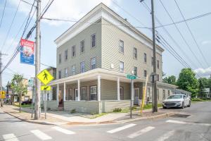 a building on a street with a car parked in front at Cozy Croghan Apartment in Croghan