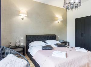 a bedroom with two beds with pillows on them at Pula Garden Apartments with Shared Pool in Pula