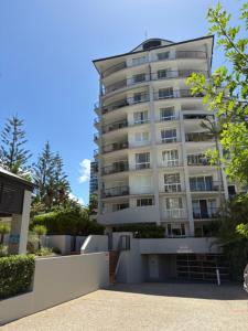 a tall white building with a lot of windows at San Mateo On Broadbeach in Gold Coast