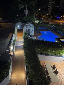 an overhead view of a swimming pool at night at San Mateo On Broadbeach in Gold Coast