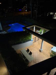 an overhead view of a swimming pool at night at San Mateo On Broadbeach in Gold Coast +68 photos