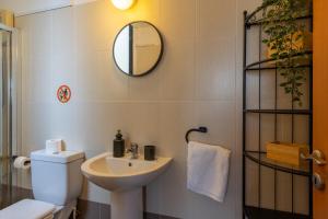 a bathroom with a sink and a toilet and a mirror at Johny's Spot in Larnaca in Larnaca +15 photos