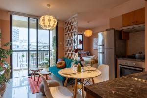 a kitchen and living room with a table and chairs at Johny's Spot in Larnaca in Larnaca