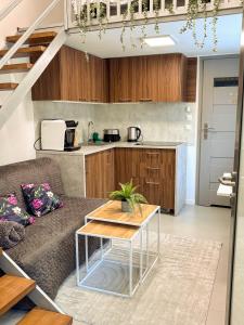 a living room with a couch and a table at Szarów 414 in Szarów