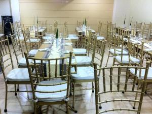a room with rows of tables and chairs at Metro Vigan Inn MAIN in San Vincente