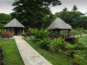 a resort with two gazebos and a path at Taveuni Dive Resort in Waiyevo