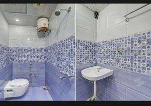 a blue and white bathroom with a toilet and a sink at RROOMS Eco Hotel Best in Lucknow