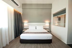 Postel nebo postele na pokoji v ubytování Hotel Arissa