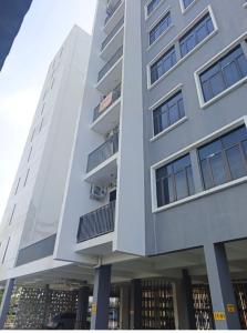 a tall building with balconies on the side of it at I&M Staycation in Alor Setar