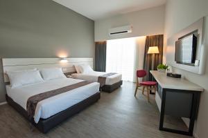 Postel nebo postele na pokoji v ubytování Hotel Arissa
