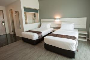 Postel nebo postele na pokoji v ubytování Hotel Arissa