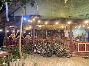 a group of bikes parked in front of a restaurant at Anouxa Riverview Guesthouse in Champasak