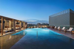 a swimming pool on the roof of a building at Thompson San Antonio - Riverwalk, by Hyatt in San Antonio