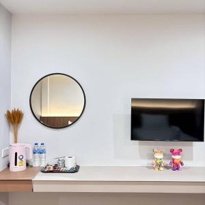 a mirror on a white wall above a counter at Ma Relax Place in Ban Hau Chang +3 photos
