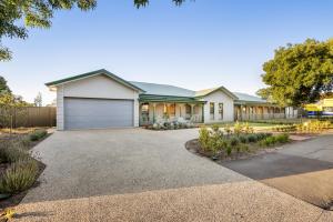 a house with a garage and a driveway at Shining House Villa A in Tanunda