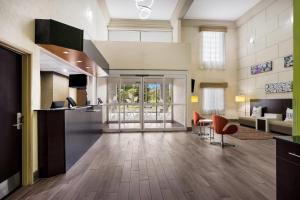 a large room with a kitchen and a living room at Sleep Inn & Suites Valdosta Mall Area in Valdosta