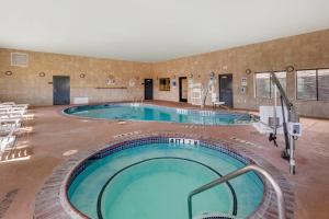 a large swimming pool in a hotel room at Comfort Inn & Suites Lubbock West in Lubbock