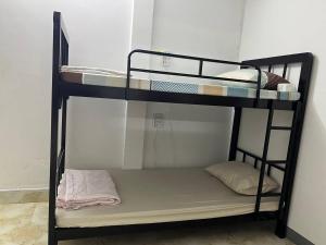 a couple of bunk beds in a room at Frog Guesthouse in Phnom Penh