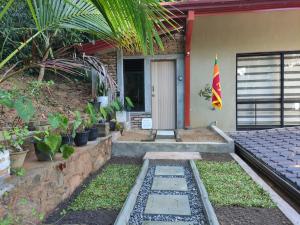 a house with a flag on the side of it at Mi casa in Kandy