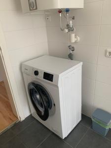 a washer and dryer in a small room at Wohnung Nähe Steyr bis 9 Personen in Ramingdorf